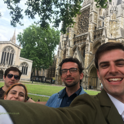 The Crew celebrate a successful finish to the shoot outside Westminster Abbey